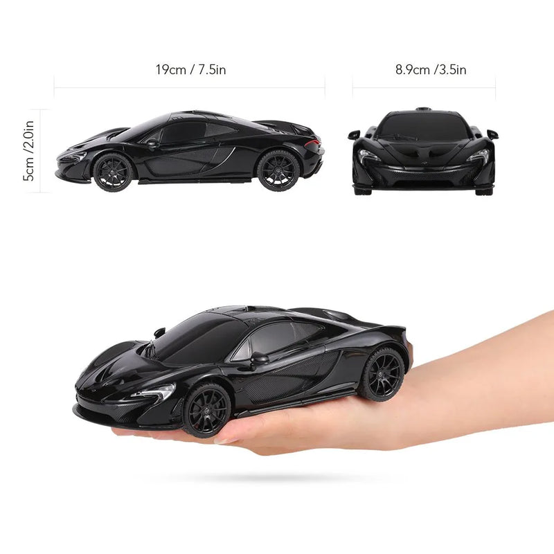 Black toy car held in a hand with measurements displayed