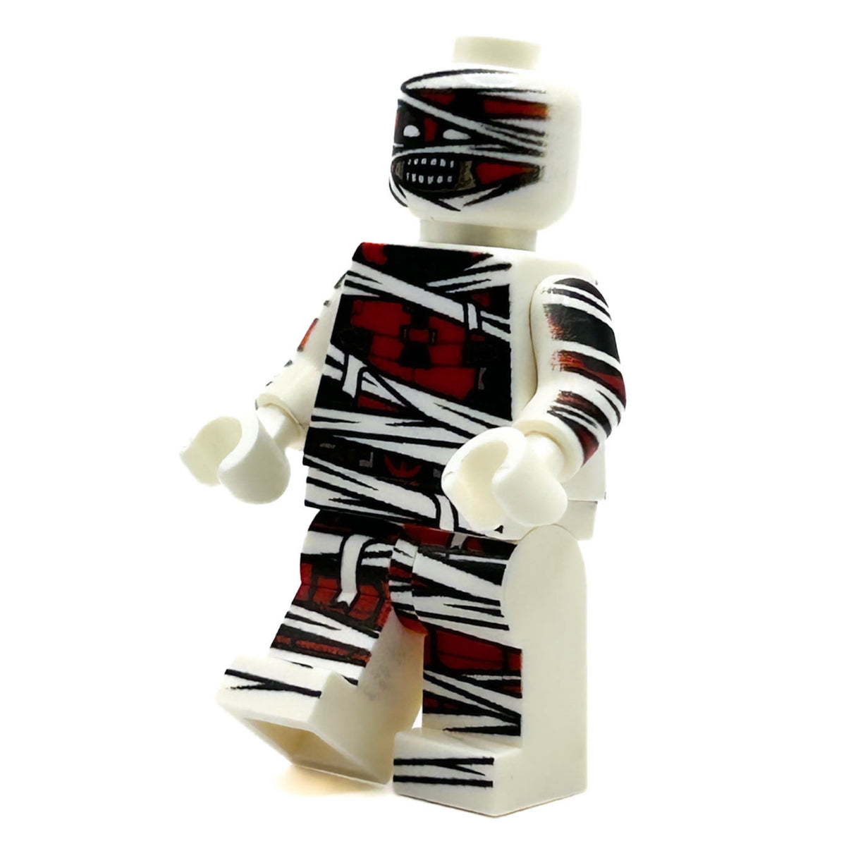 Toy figure with mummy-themed design on a white background
