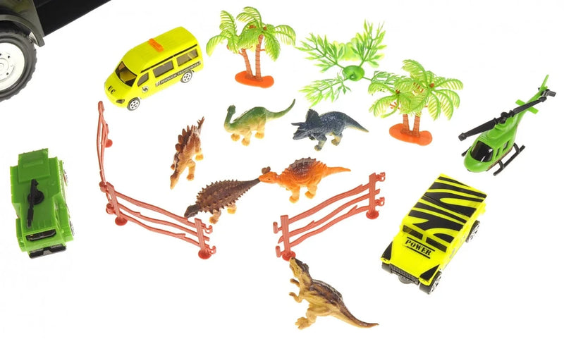 Close-up of dinosaur truck carrier accessories including dinosaur figures, toy vehicles, trees, and fences