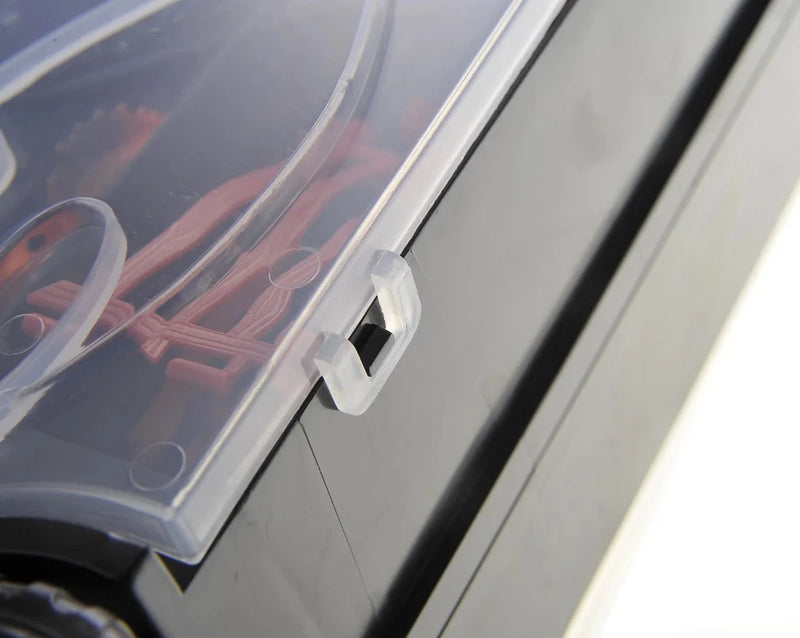 Latch closeup on the dinosaur truck carrier toy's transparent case for secure transportation