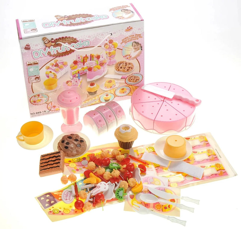 DIY fruit cake toy set with cake pieces, utensils, cup, cupcake, and additional play accessories for kids