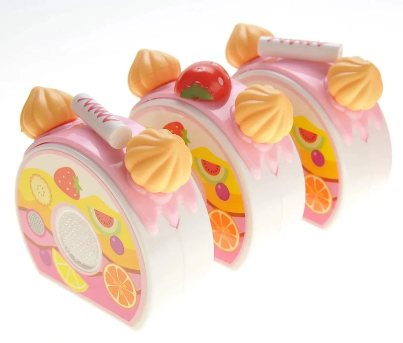 Toy cake roll slices with fruit decorations from the DIY fruit cake play set for kids."

