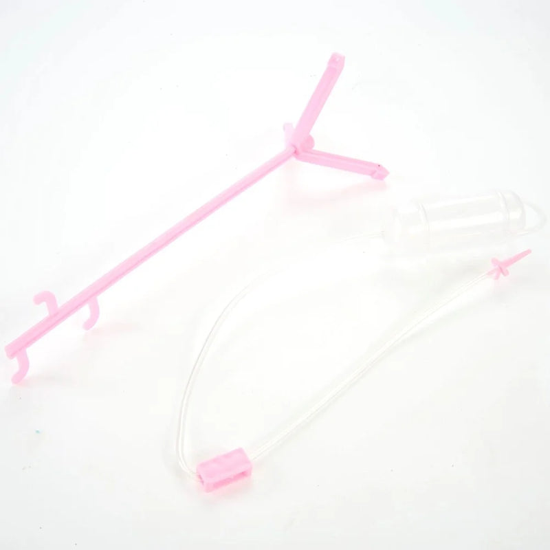 Pink IV stand toy with attached clear tubing, part of a doctor role-play set