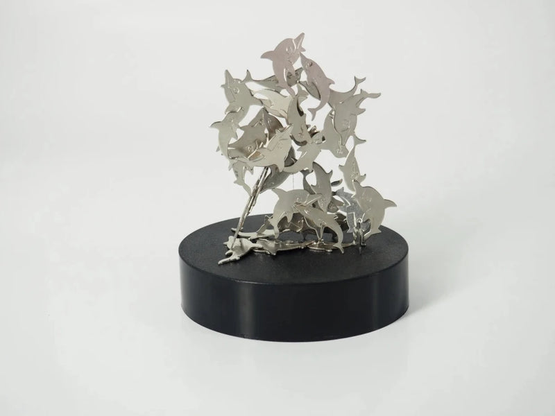 Magnetic building toy with dolphin pieces stacked creatively, showcasing a fun and stress-relieving activity.
