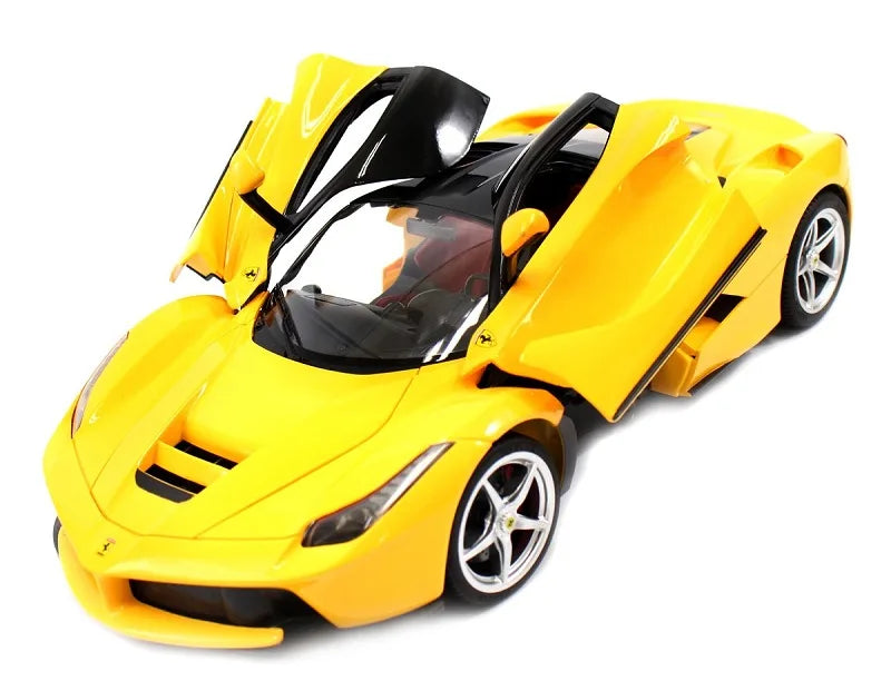 Yellow toy sports car with open doors on a white background