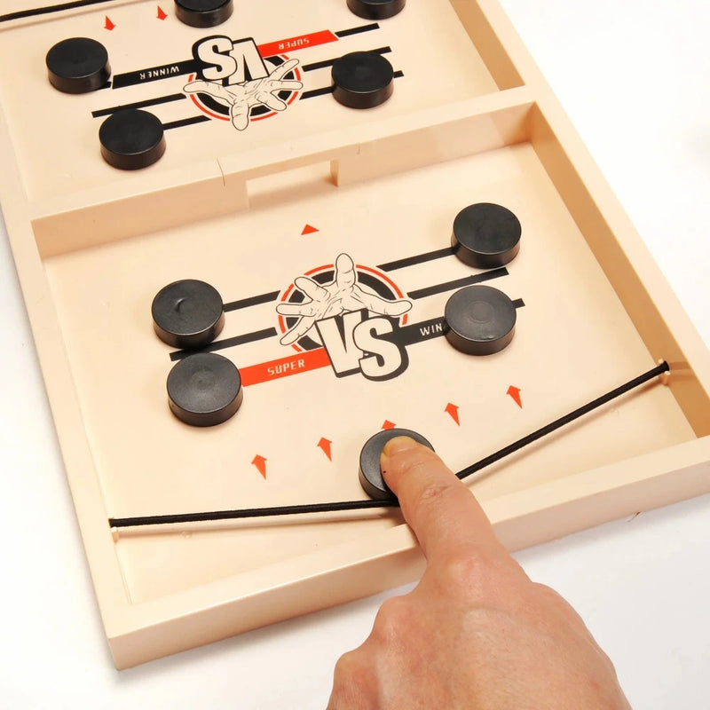 Close-up view of Fast Action Finger Sling Game board with puck placement for quick reflex challenge