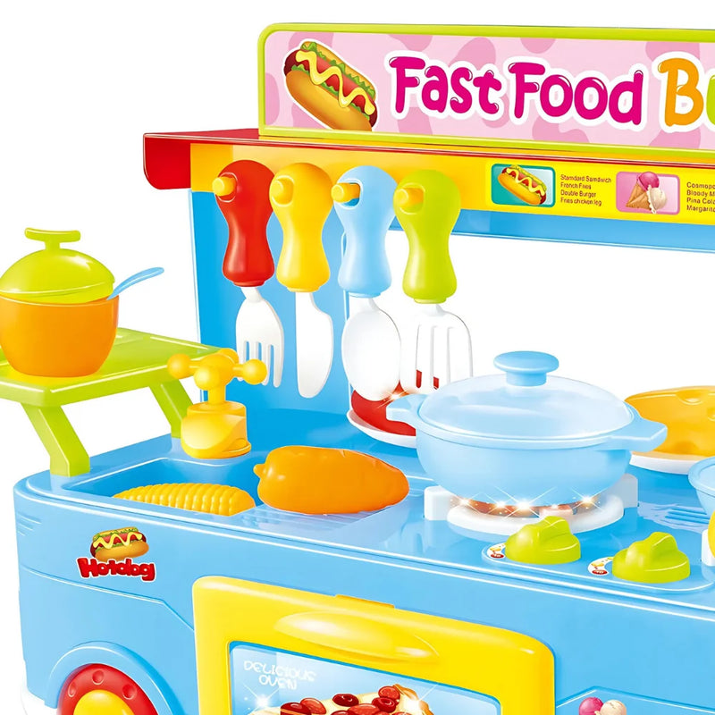 Closeup of cooking utensils and food items in the fast food bus toy playset