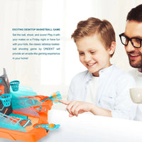 Father and son enjoying an arcade basketball tabletop game together at home