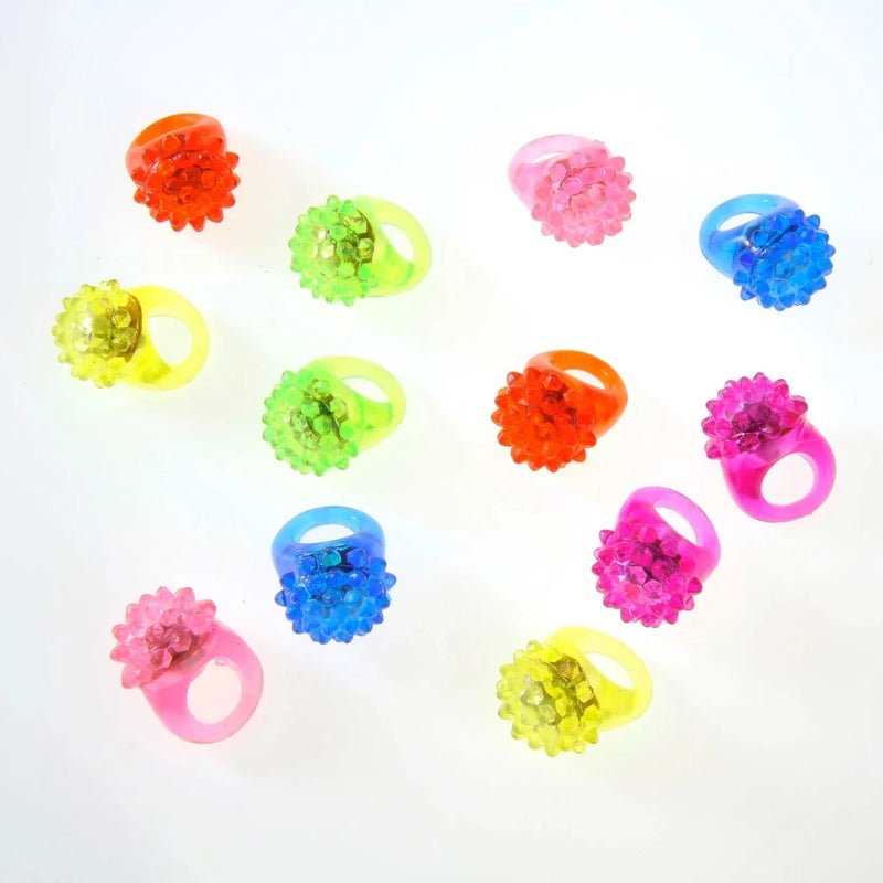 Colorful Blinky Rings with LED lights in various colors, great for nighttime events and celebrations.