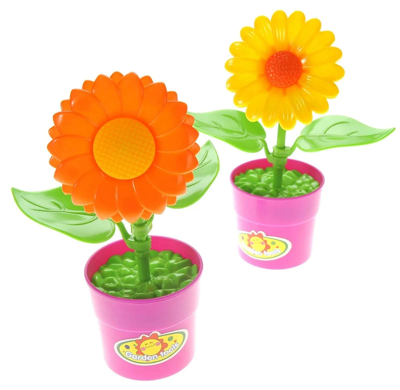 Toy flower pots with green leaves and vibrant orange and yellow flowers in kids gardening set