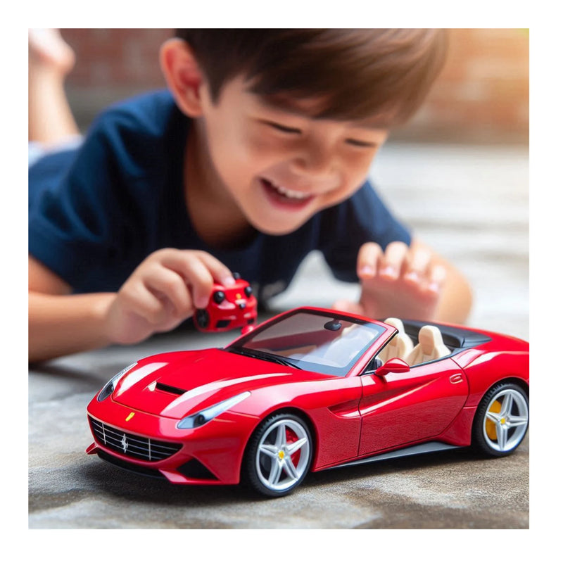 Child playing with a red toy car on a wooden floor