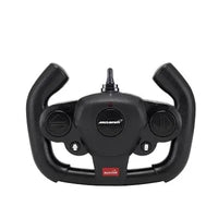 Black steering wheel with McLaren logo on a white background