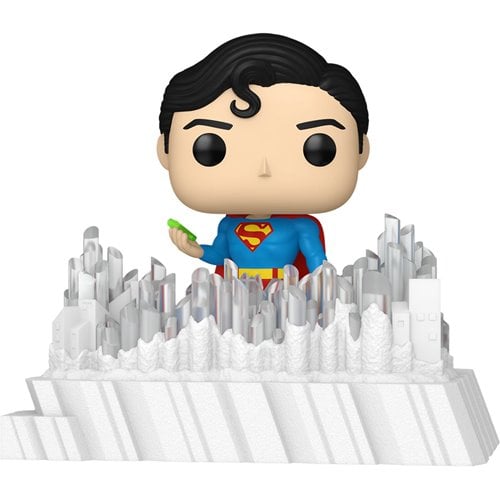 Superman figurine with a cityscape background