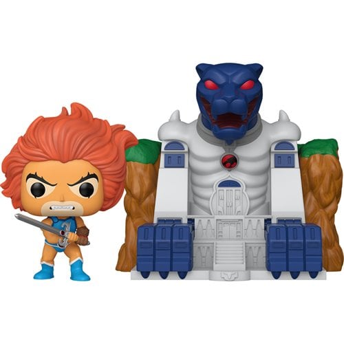Toy figure of a character with orange hair and blue outfit, standing next to a toy castle with a blue dragon-like creature on top.