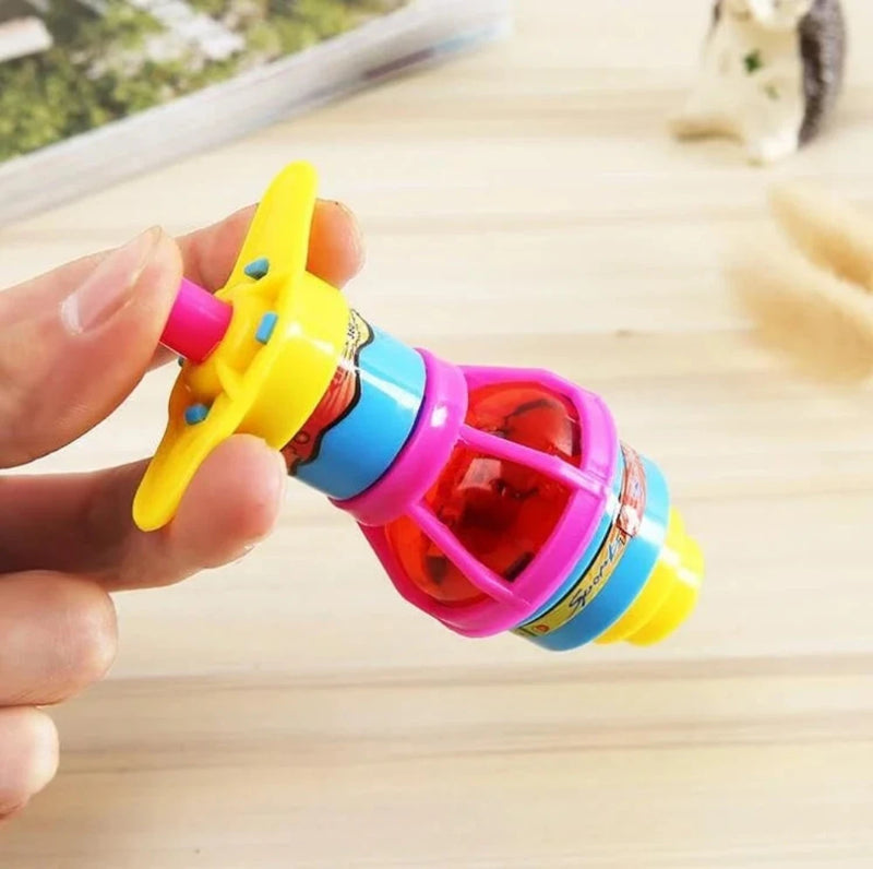 Compact LED gyro spinning top held on a wooden surface, highlighting colorful design ideal for kids' hands.