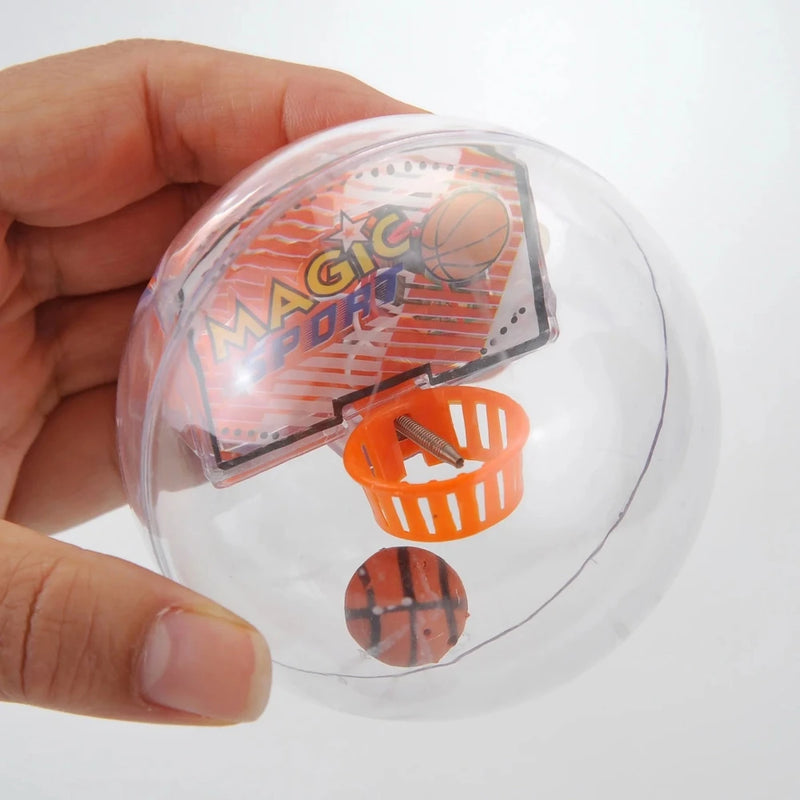 Hand holding Magic Sport Basketball game toy - compact mini hoop and basketball for handheld fun.