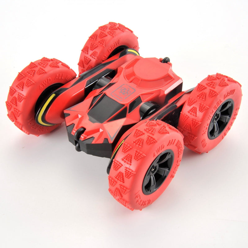 Red toy vehicle with large wheels on a white background