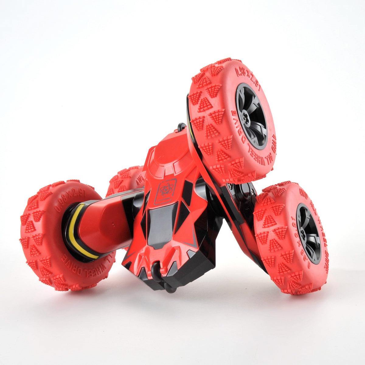 Red toy car with large wheels on a white background