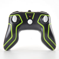 Black game controller with green accents on a white background