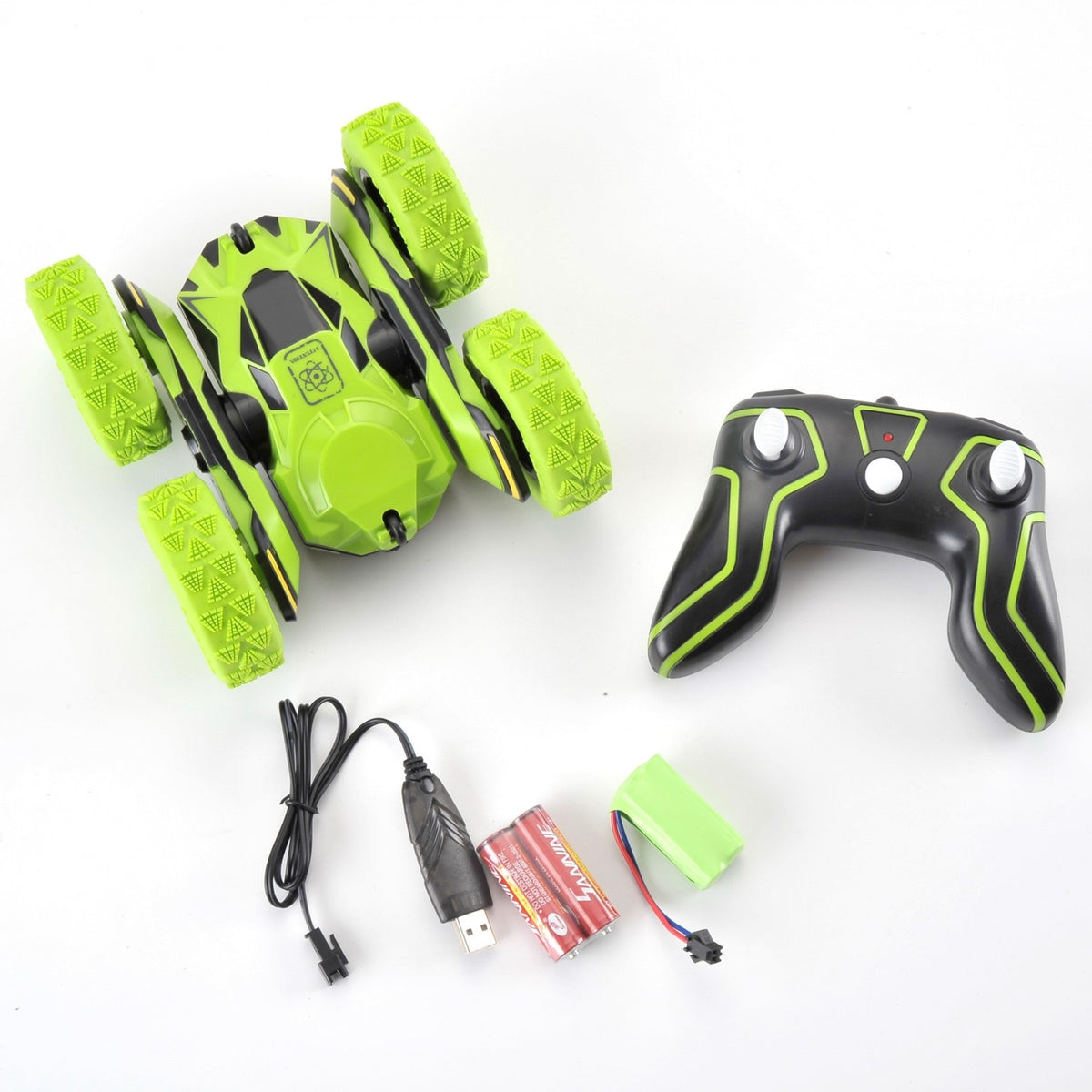 Green and black remote control car with controller and accessories on a white background