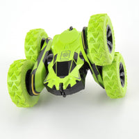 Green toy vehicle with large wheels on a white background