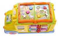 Top view of intellectual school bus toy with shape-sorting puzzle and music button