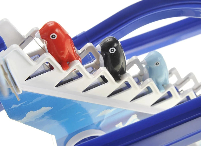 Close-up of penguin figurines in the Jolly Penguin Race toy set
