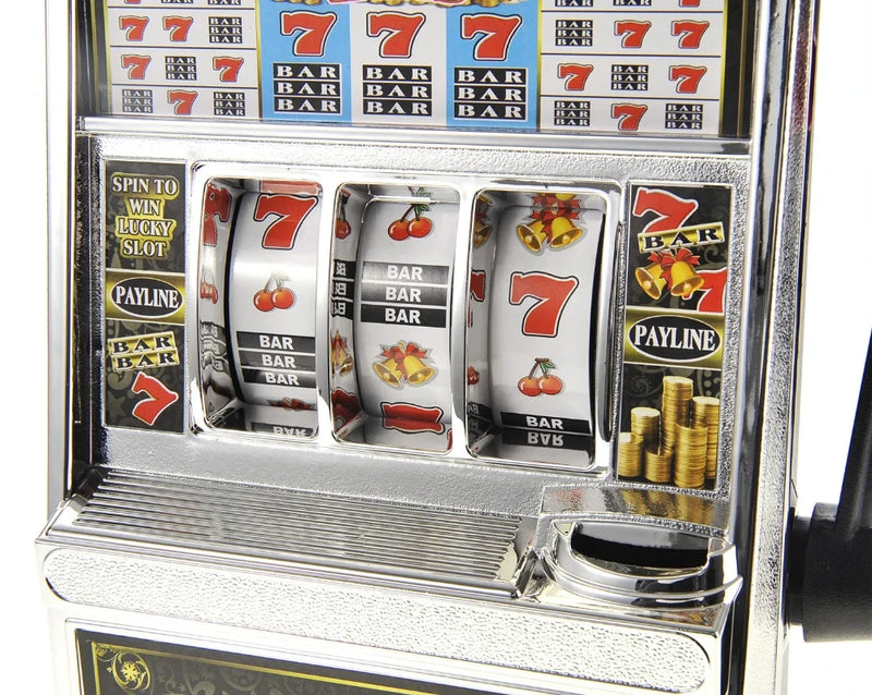 "Close-up of jumbo slot machine toy's spinning reels with icons like cherries and bars for a classic slot look