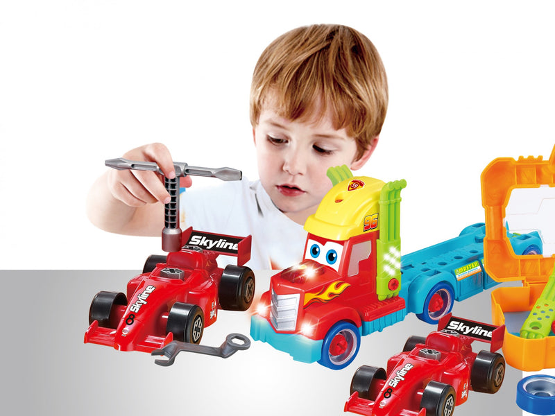 Kid repairing a take-apart racing car toy using included tools, ideal for fostering interest in mechanics and engineering