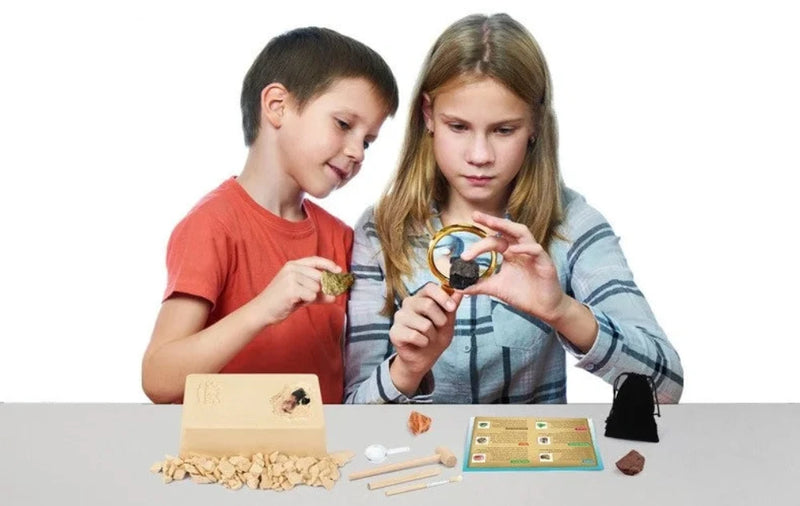 Children using Rocks and Minerals Mining Kit, examining gemstones and learning geology through hands-on play