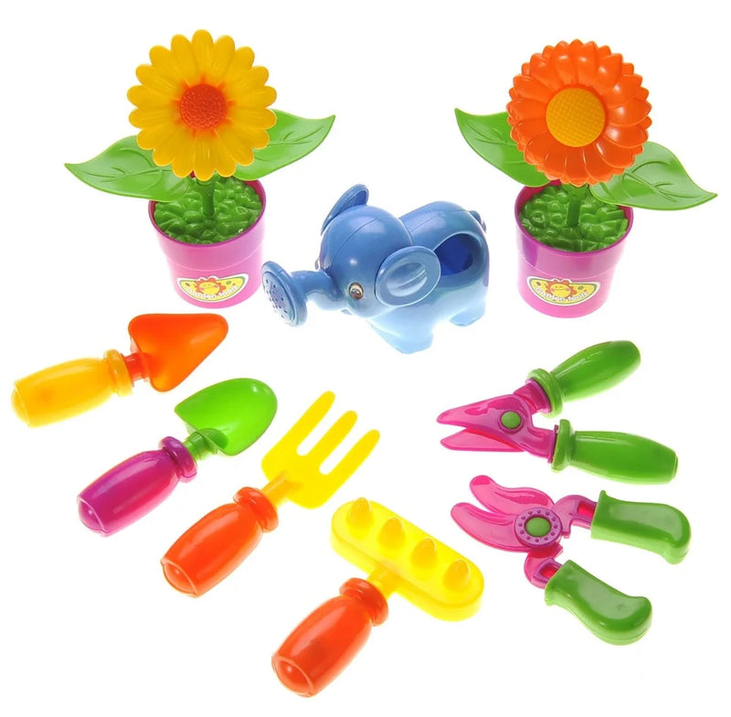 Colorful kids gardening tools set with elephant watering can, pots with flowers, and various garden tools for children.