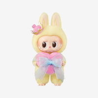 Plush toy with bunny ears and a heart-shaped bow on a white background