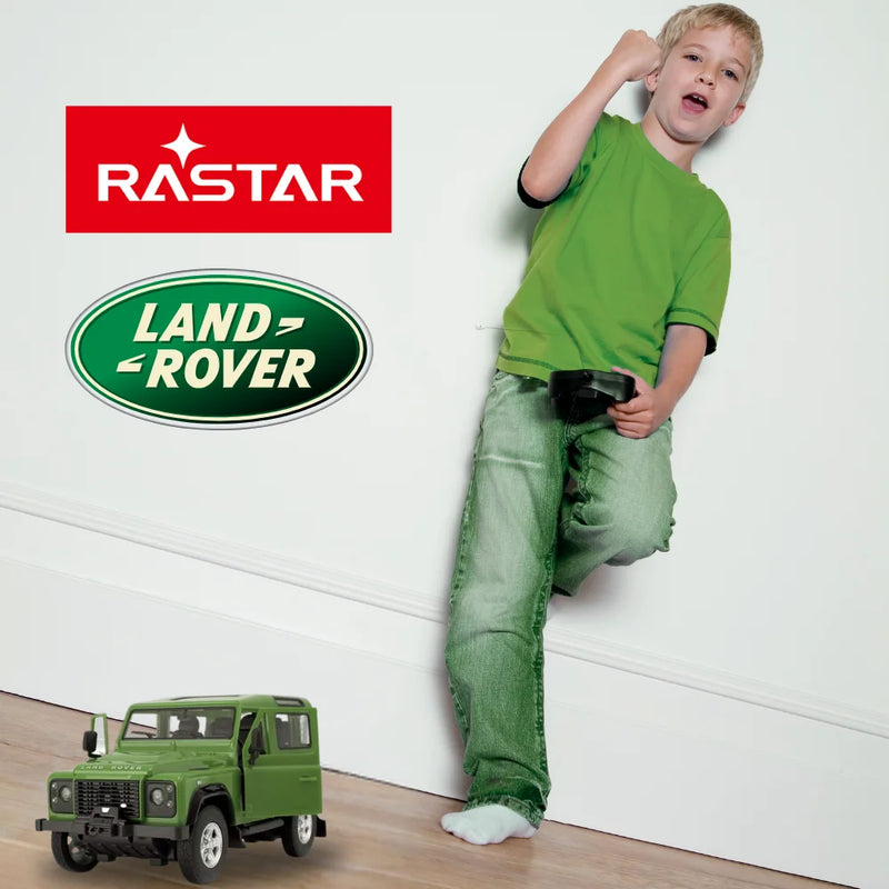 Excited child playing with the Land Rover Defender RC car, a perfect toy for young Land Rover enthusiasts.