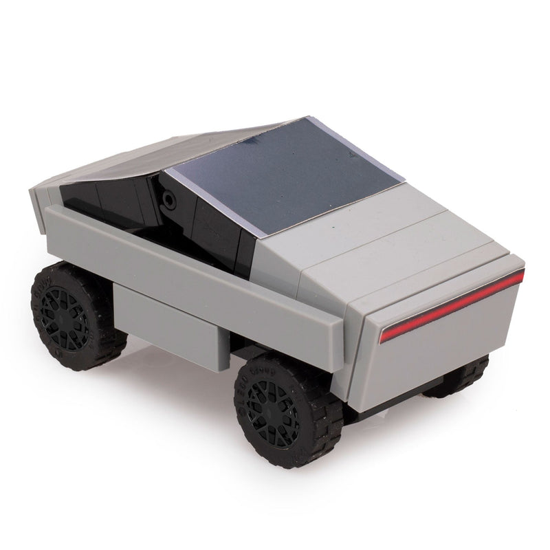 Toy car made of interlocking bricks on a white background