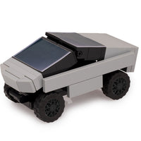 Toy robot with solar panel on a white background