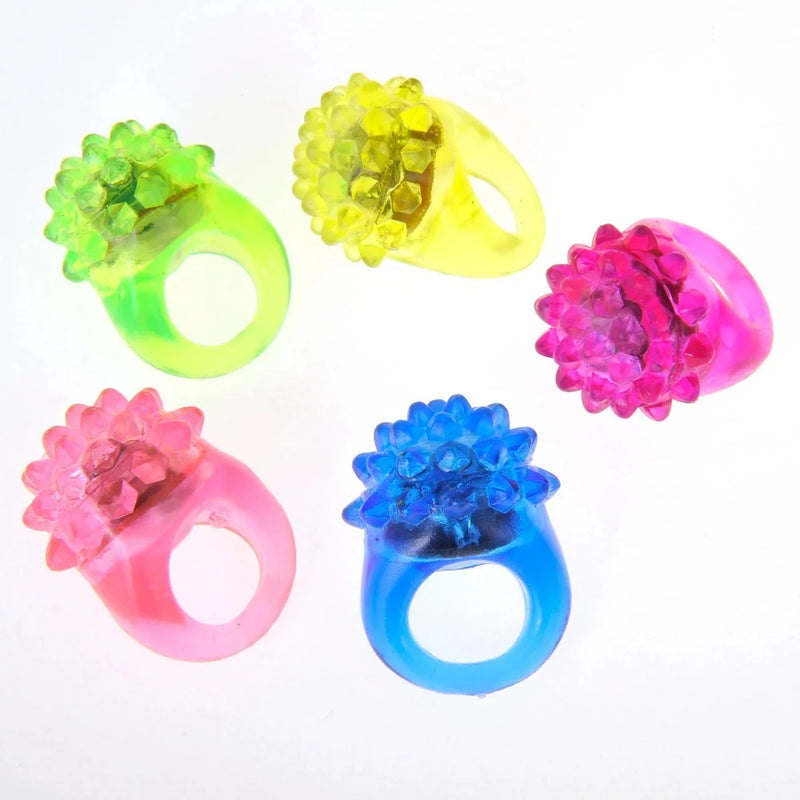 Set of five Light Up Rings in pink, green, blue, yellow, and purple, ideal for glow-in-the-dark parties