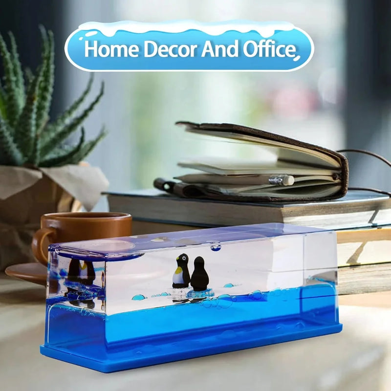 Penguin liquid motion toy placed on a desk, perfect for home and office decoration.