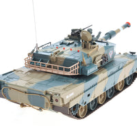 Model tank with camouflage pattern on a white background