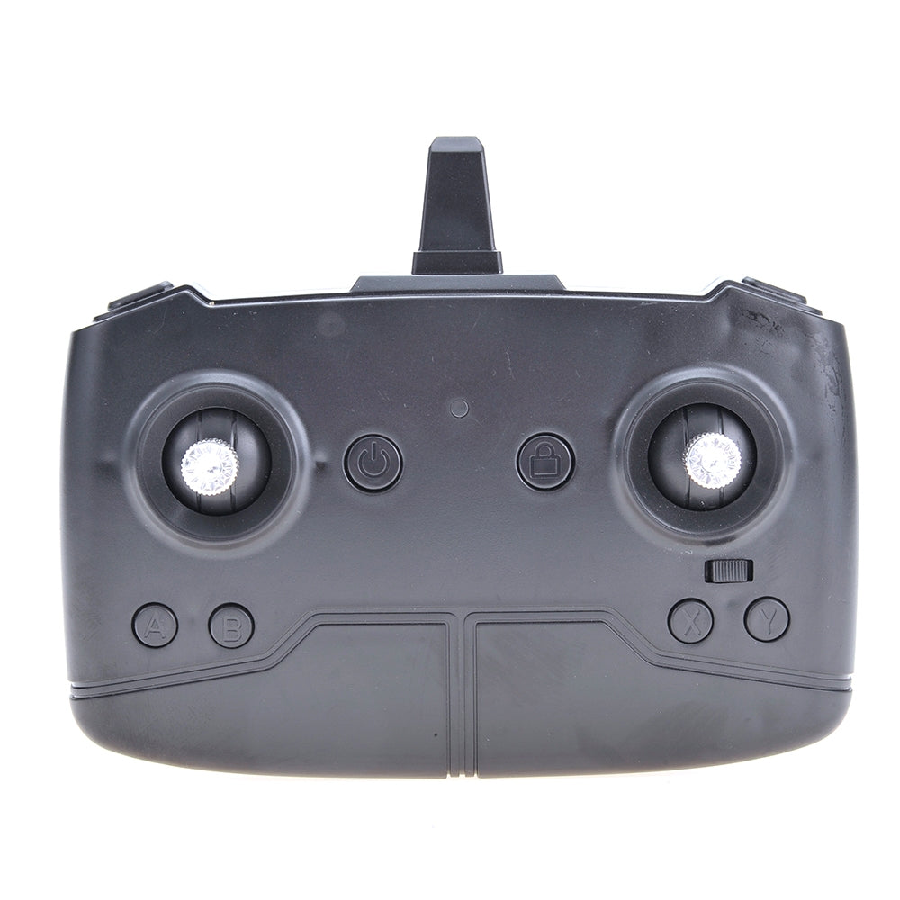 Black remote control device on a white background