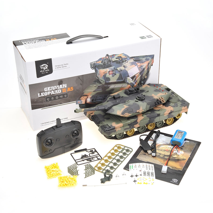 Toy tank with remote control and accessories on a white background
