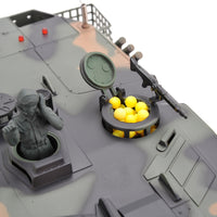 Model tank with a figure and ammunition on a white background