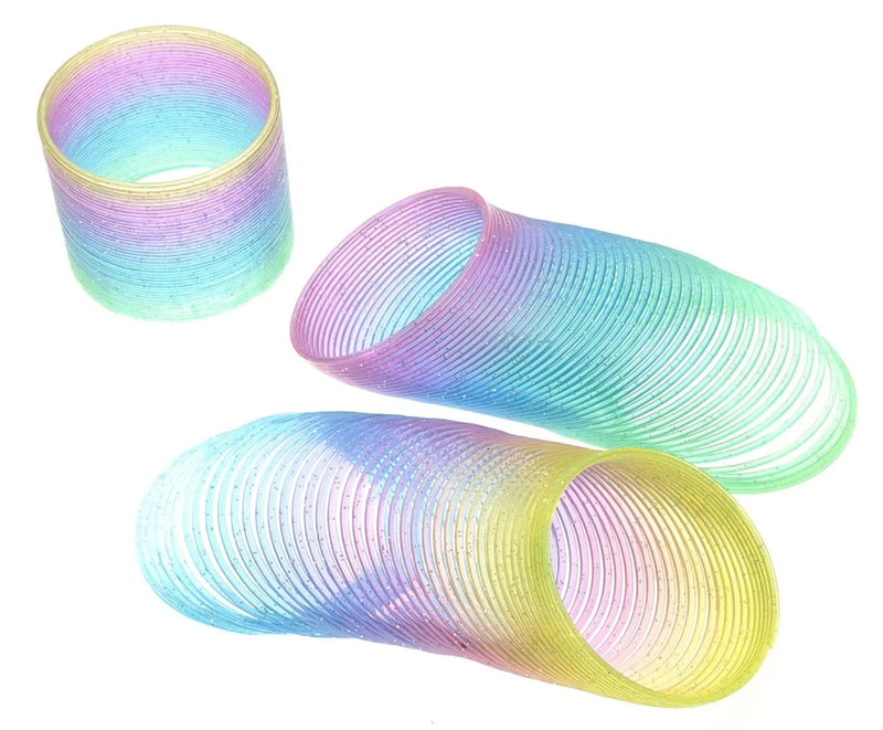 Extended plastic rainbow magic spring in purple and green, showcasing flexible play possibilities.
