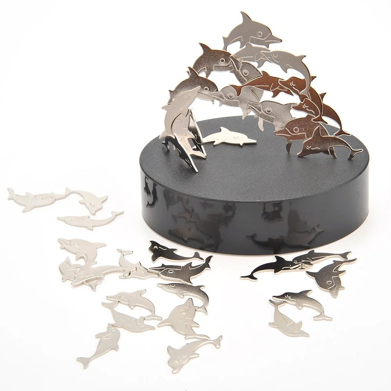 Unique magnetic dolphin desk toy set with dolphin pieces creatively balanced on a black base.