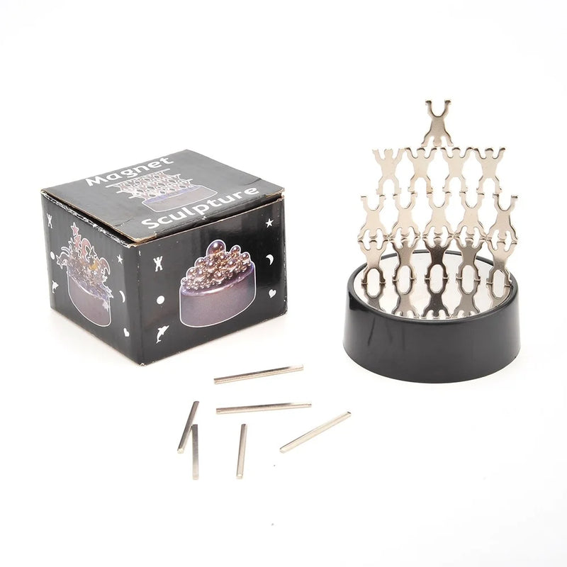  Complete magnetic sculpture set with packaging and metallic figures.