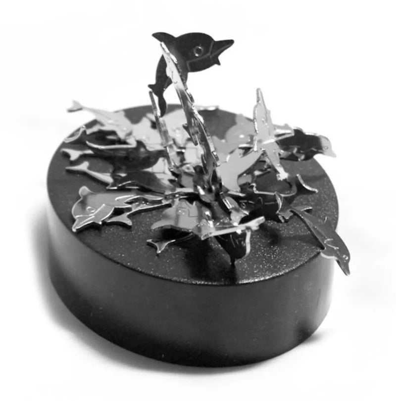  Elegant magnetic sculpture with dolphin-shaped pieces balanced on a platform, designed for relaxation.