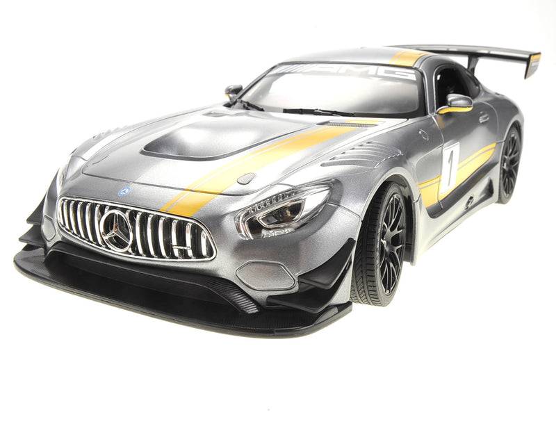 Silver and black model car with yellow stripes on a white background