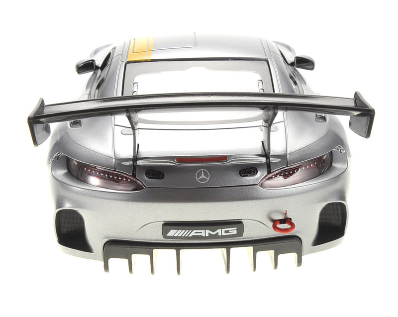 Back view of a Mercedes-AMG car with a prominent spoiler on a white background