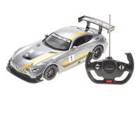 Model car with AMG branding and remote control on a white background