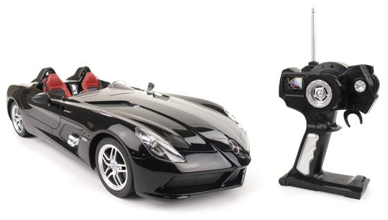 Black toy car with open top and remote control on a white background