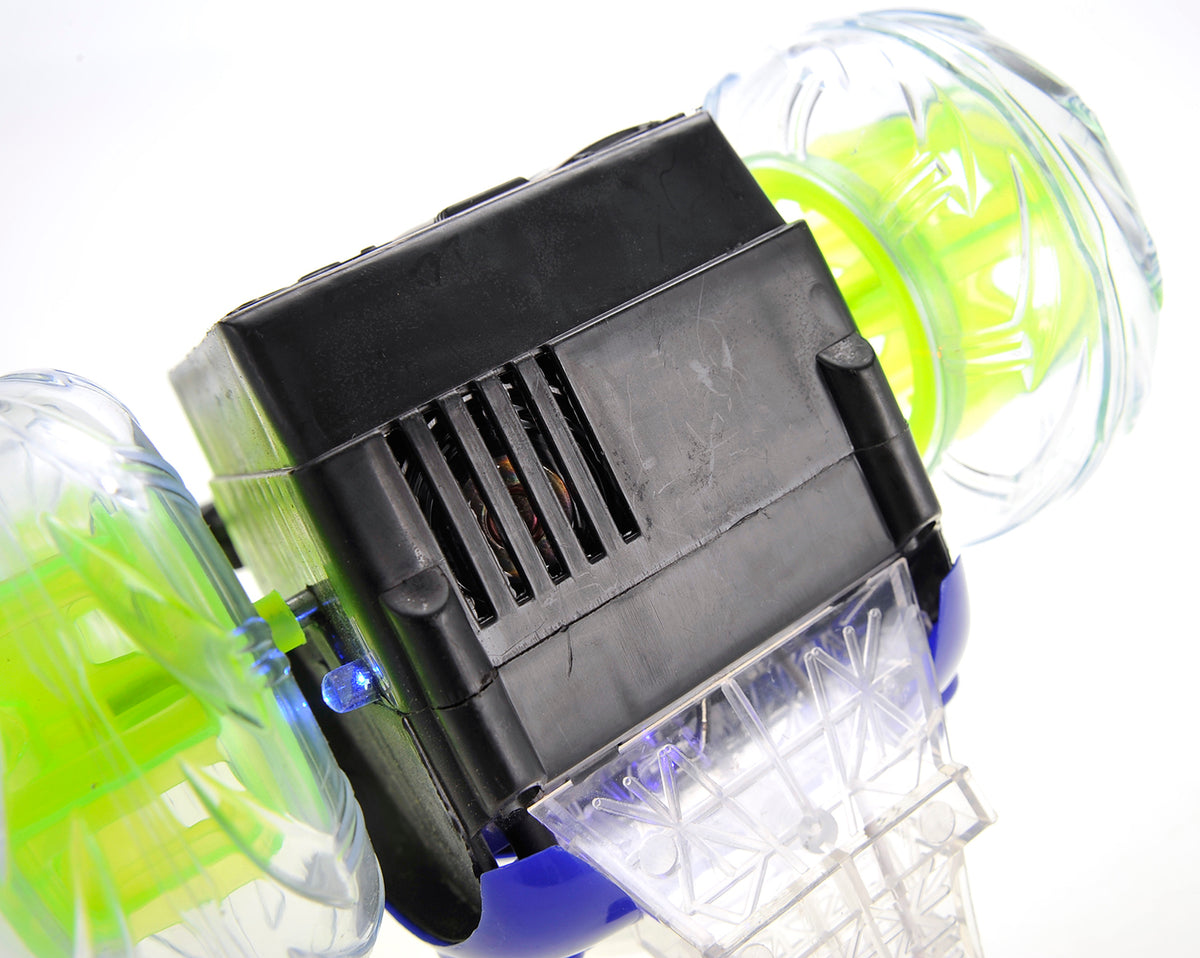 Close-up of a black electronic device with green and blue components on a white background